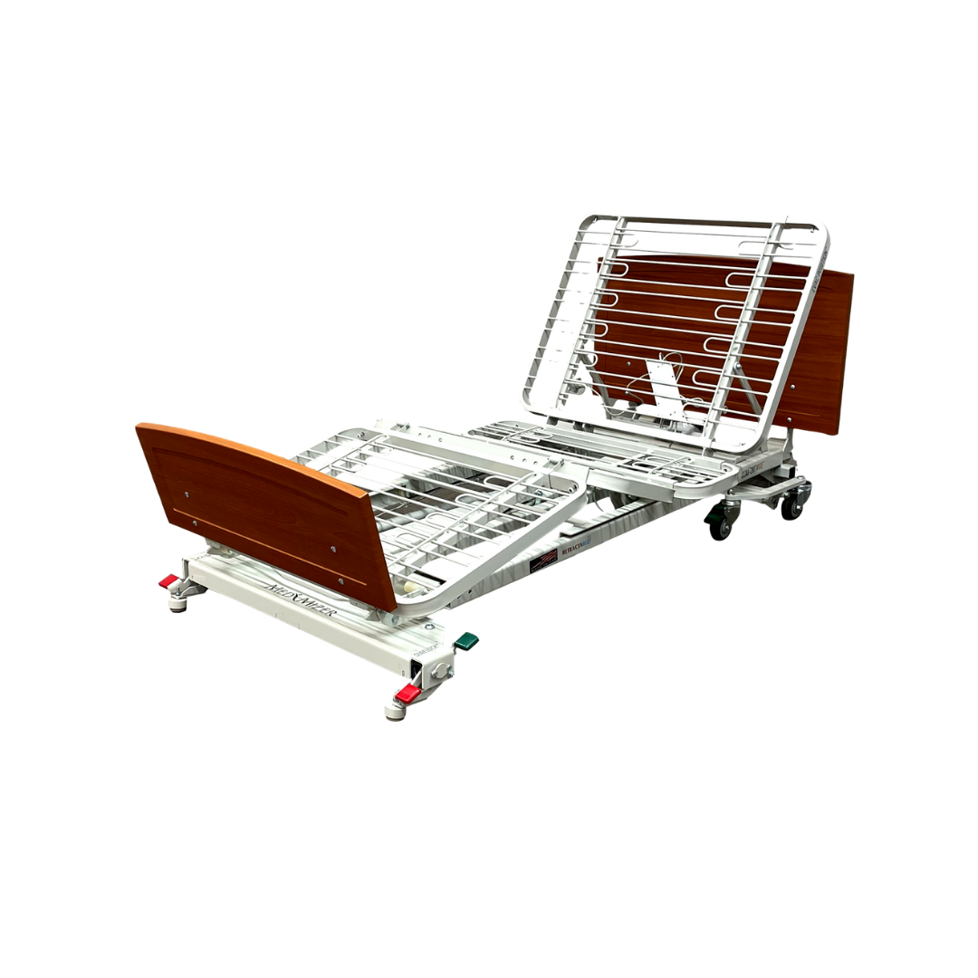 The Med-Mizer RetractaBed is a bariatric hi/low electric bed with adjustable width, a metal frame, wooden headboard and footboard, wheels for mobility, space-saving safety features, and adjustable backrest and leg sections for comfort.